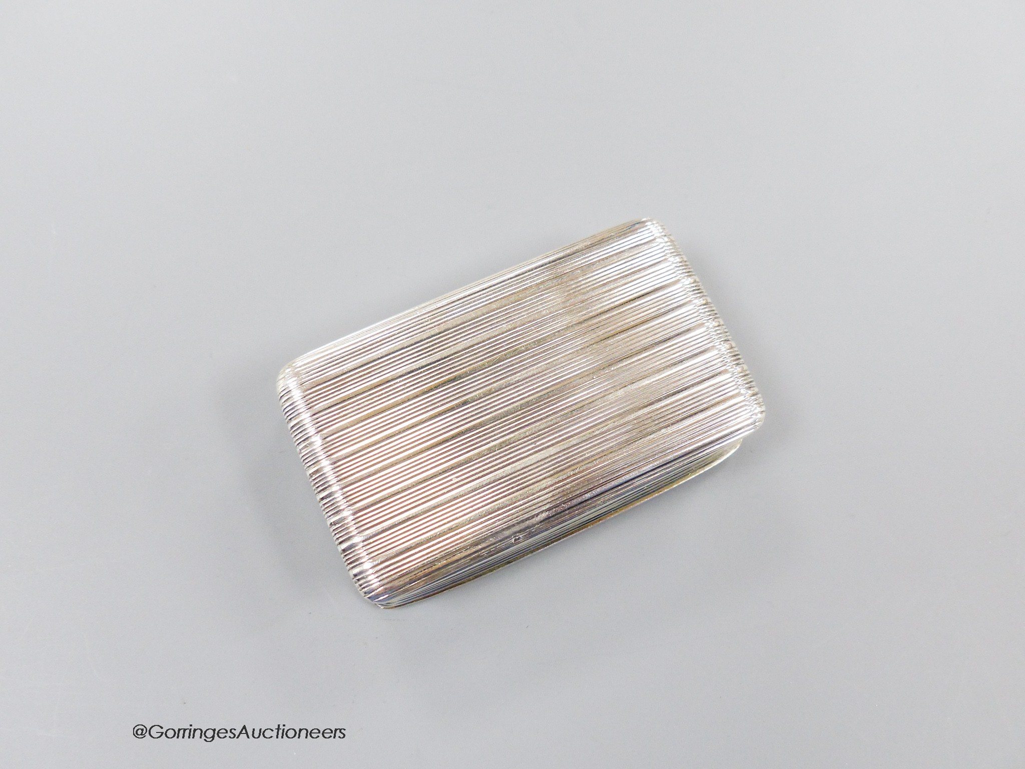 A George IV ribbed silver rectangular snuff box, with engraved inscription, Thomas Shaw, Birmingham, 1824, 71mm, 74 grams.